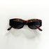 Lunettes Jean Patou vues de face – monture écaille marron foncé et verres teintés