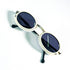Vue plongeante des lunettes de soleil ovales Courrèges G100 monture ivoire