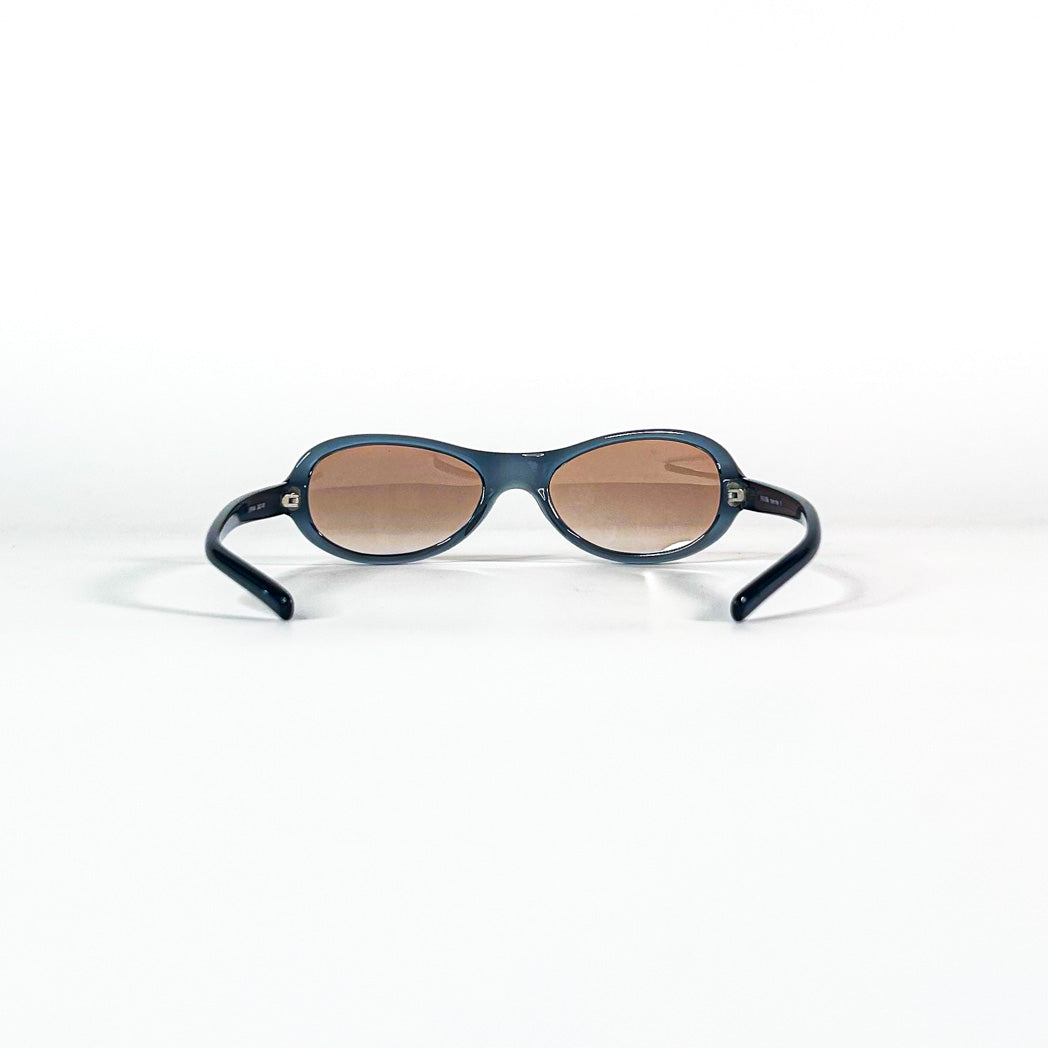 Vue frontale lunettes Prada SPR 04A 2AD-1A1 ovales bleues