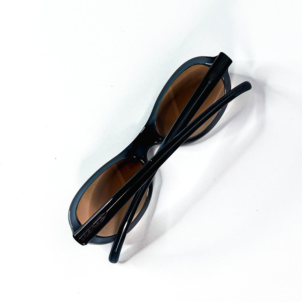 Lunettes de soleil Prada SPR 04A 2AD-1A1 ovales bleues avec verres bruns