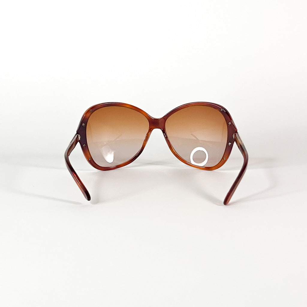Charnière vissée et logo Diesel sur branche de lunettes vintage