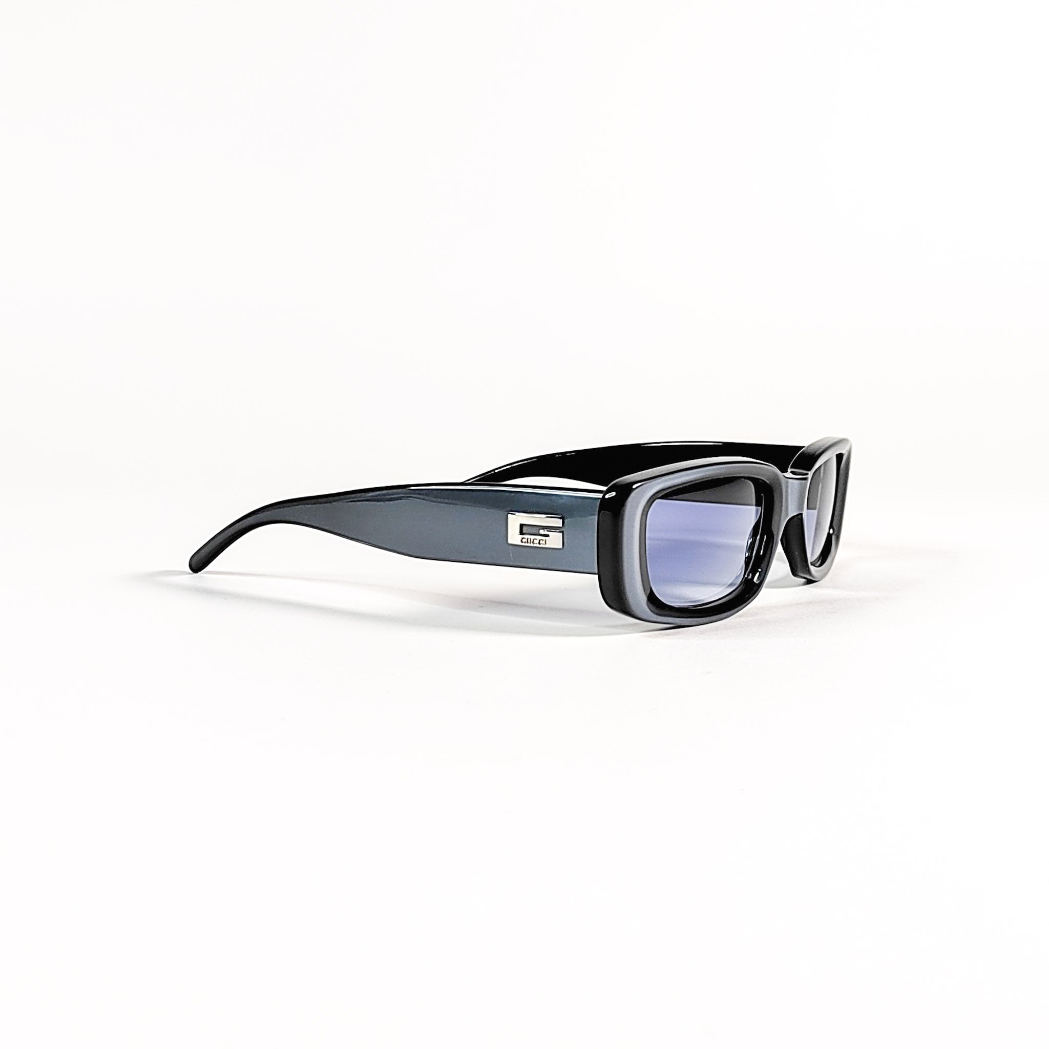 Gucci GG 2409/N/S, profil complet de la monture acétate noir Tom Ford era avec branche galbée.